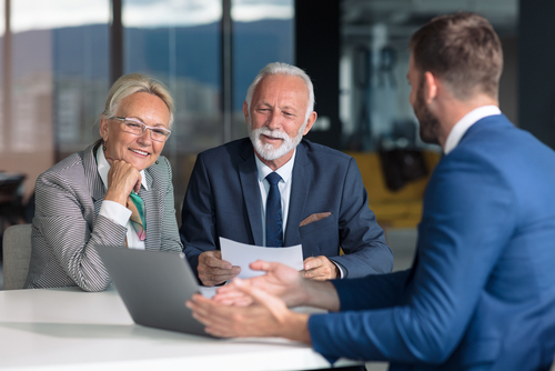 Business owners reviewing funding options in a modern office